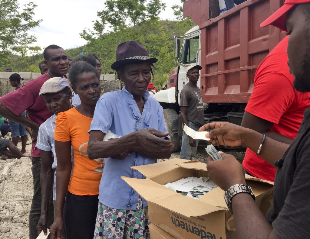 Haitians line up for food assistance as humanitarian crisis worses, warn humanitarian advisors
