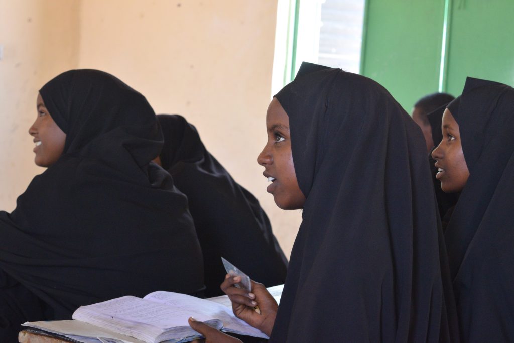 Sudanese girls study and temporary child safe space at humanitarian centre for displaced people as civil war continues in Sudan